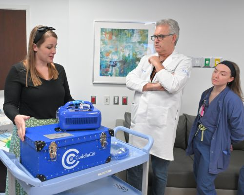 Leslie Burman of Be Like the Willow Movement speaks with hospital staff about a CuddleCot donated to Lenox Hill Hospital through Ashlie’s Embrace.
