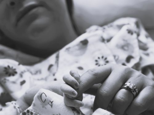Ashlie Cathren’s tiny fingers wrapped around her mother Erin’s finger shortly after her birth.