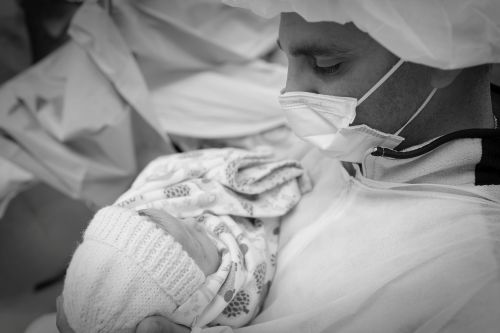Tony Maroon holding his daughter, Ashlie Cathren, shortly after her birth.