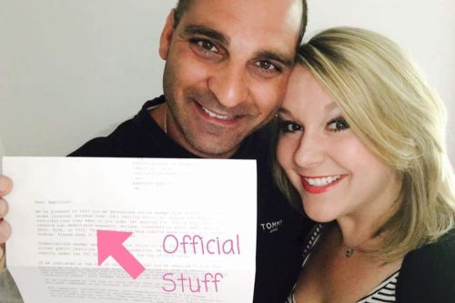 Ashlie’s Embrace founders Erin and Tony Maroon holding the IRS determination letter recognizing the organization as a 501(c)(3) nonprofit.